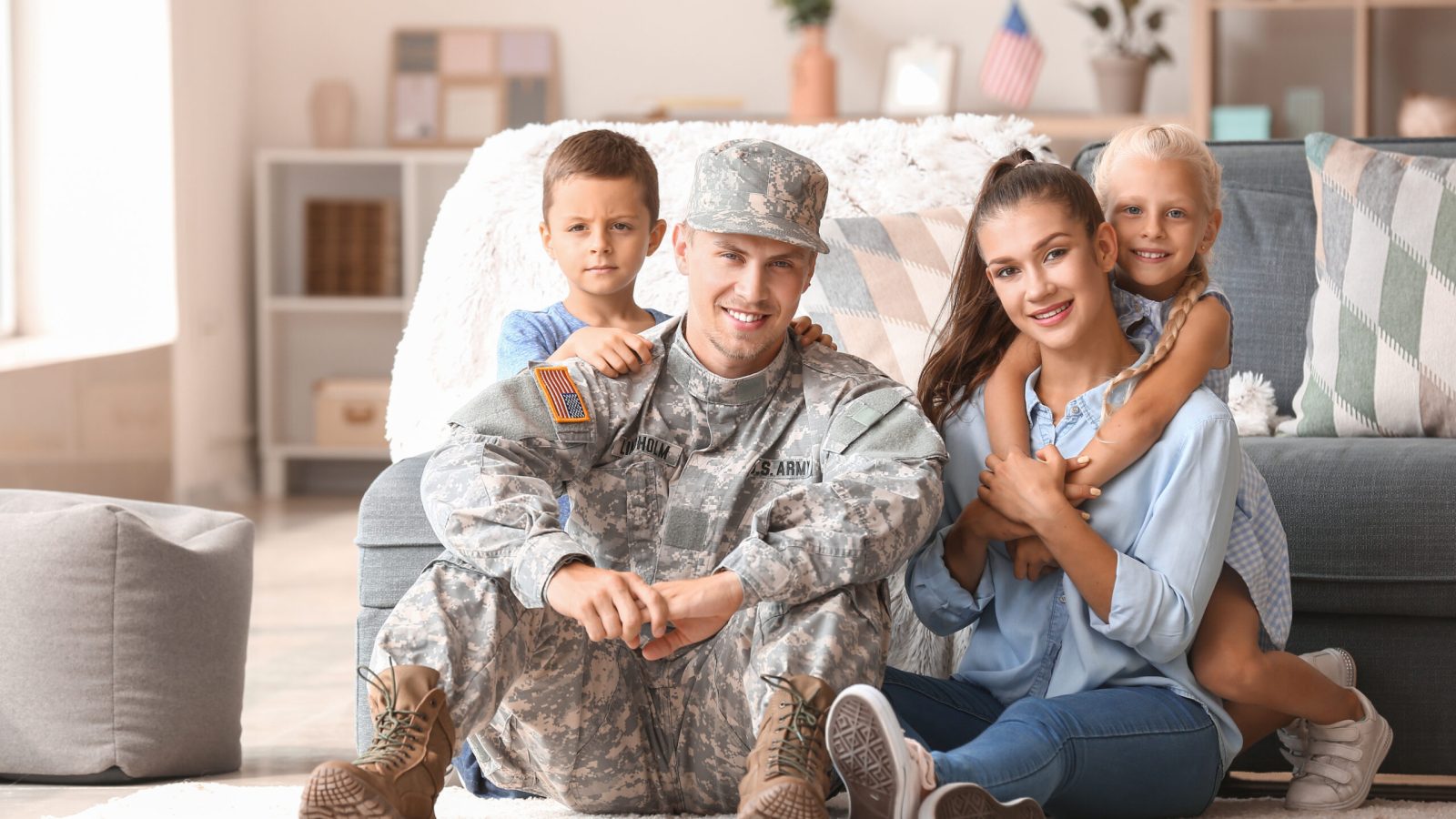 Happy military man with his family at home