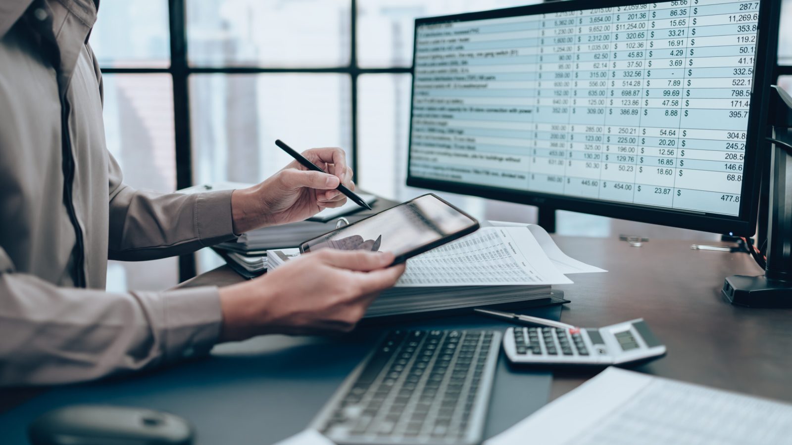 Investors working on desk office and use tablet to  check tracking cost. Accounting and  Financial concept.