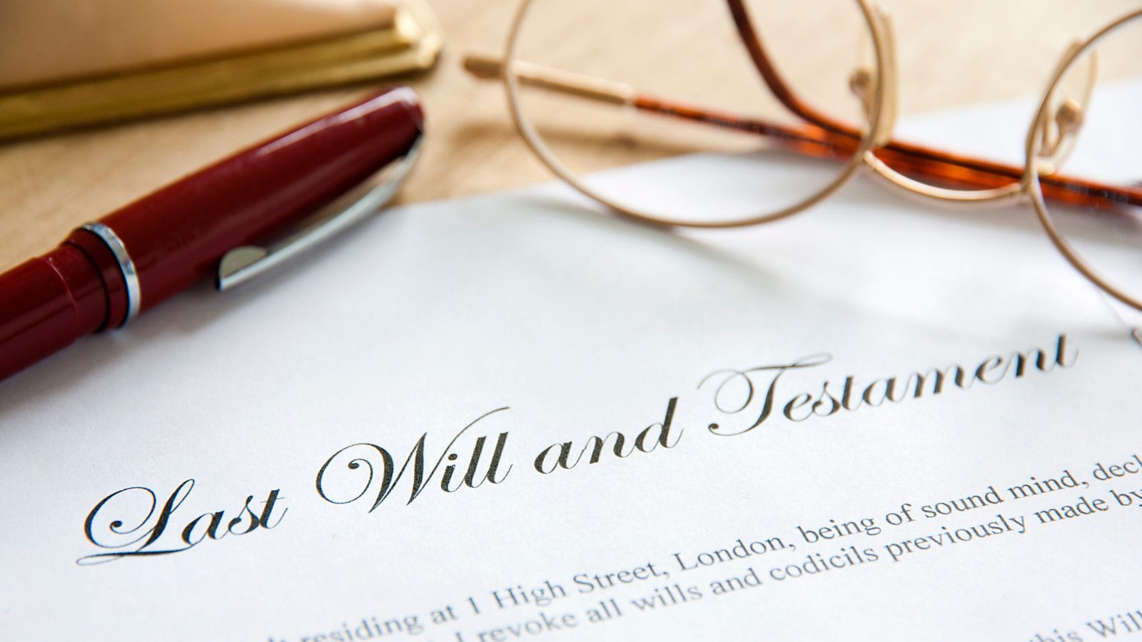 Last Will and Testament concept image complete with spectacles and pen.