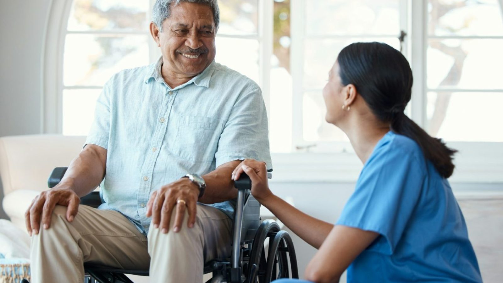 cropped-shot-of-a-handsome-senior-man-and-his-female-nurse-in-the-old-age-home.jpg
